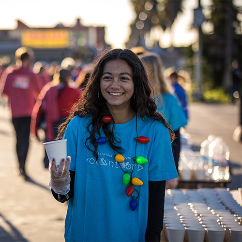 girl volunteer with water cup